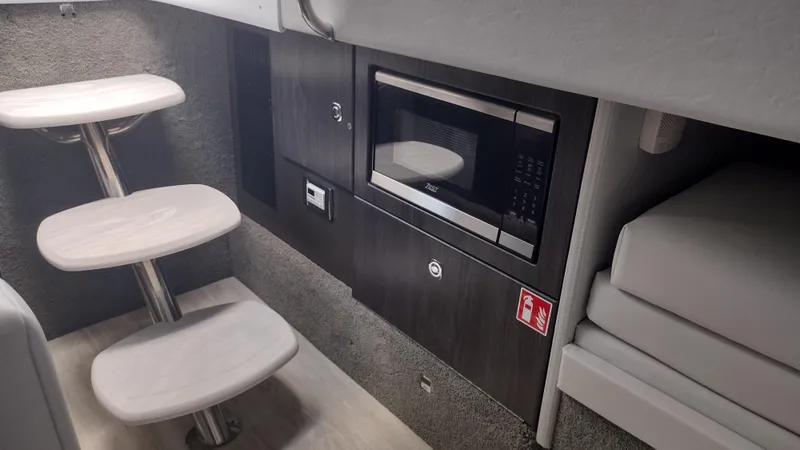 Slide: The Image of Interior of 2026 Formula 330 CBR boat with microwave and modern staircase. - 40