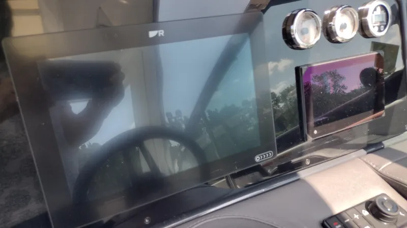 Slide: The Image of Dashboard of a 2026 Formula 330 CBR boat with digital displays and gauges. - 44