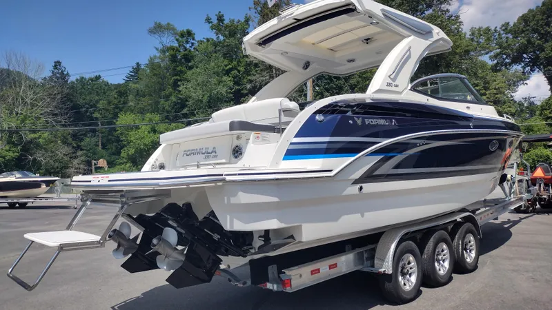 Slide: The Image of 2026 Formula 330 CBR boat on trailer, featuring sleek design and dual engines. - 5
