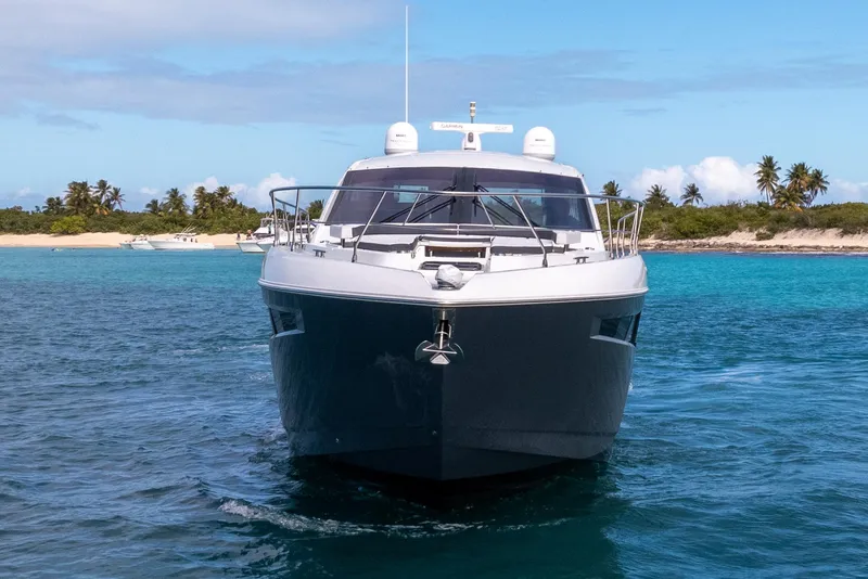 Slide: The Image of 2019 Cruisers Yachts 50 Cantius on turquoise water near a tropical beach. - 1