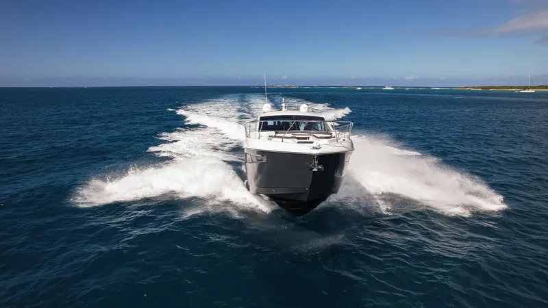 Slide: The Image of 2019 Cruisers Yachts 50 Cantius speeding on open water. - 10