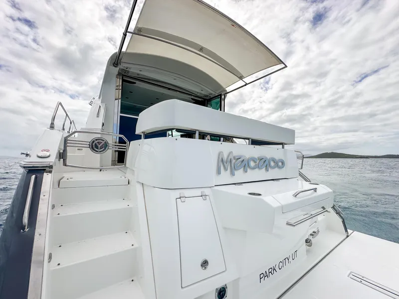 Slide: The Image of 2019 Cruisers Yachts 50 Cantius, rear view with Macaco name, docked in Park City, UT. - 26