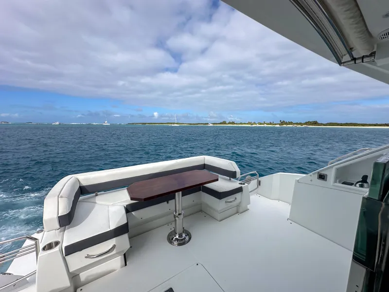 Slide: The Image of 2019 Cruisers Yachts 50 Cantius deck with ocean view and island in the distance. - 28