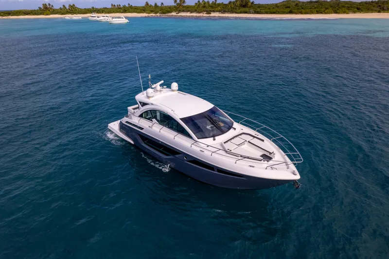 Slide: The Image of 2019 Cruisers Yachts 50 Cantius luxury yacht cruising in clear blue waters. - 3
