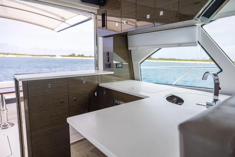 Slide: The Image of Modern kitchen area on 2019 Cruisers Yachts 50 Cantius with ocean view. - 30