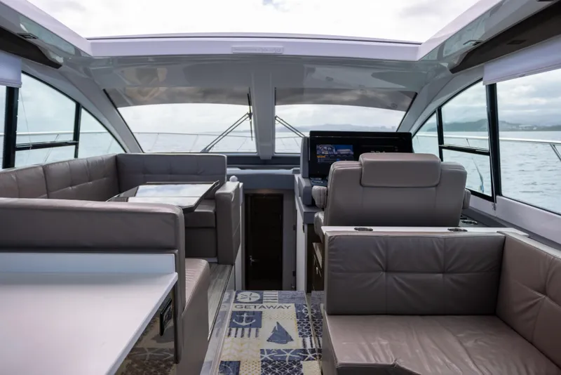 Slide: The Image of Interior of 2019 Cruisers Yachts 50 Cantius with modern seating and navigation area. - 32
