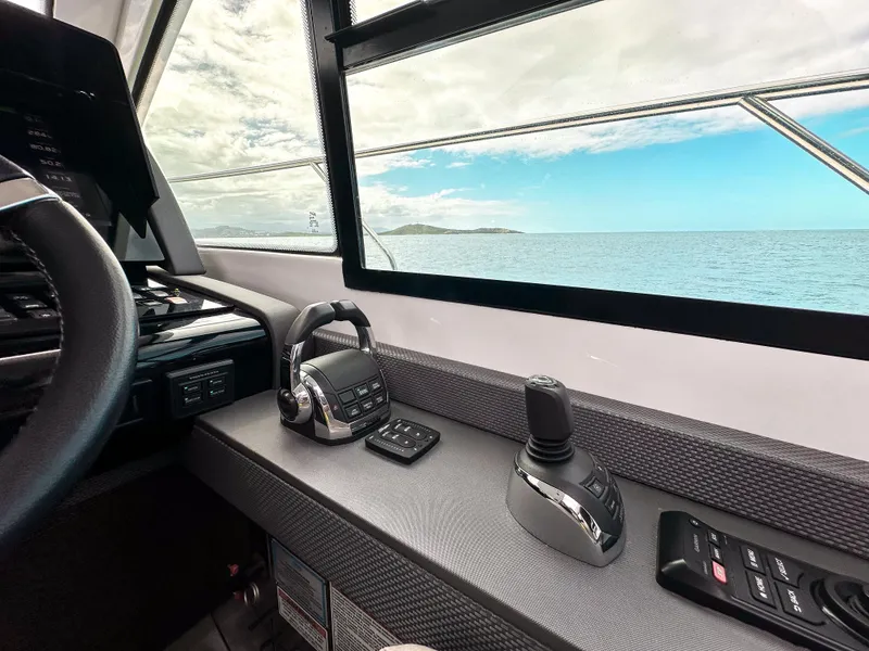Slide: The Image of Interior helm of 2019 Cruisers Yachts 50 Cantius with ocean view. - 36
