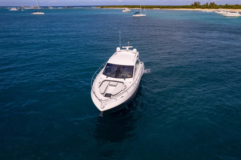 Slide: The Image of 2019 Cruisers Yachts 50 Cantius cruising in clear blue waters. - 4