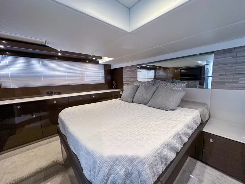Slide: The Image of Luxurious bedroom interior of 2019 Cruisers Yachts 50 Cantius with modern decor and ample storage. - 40