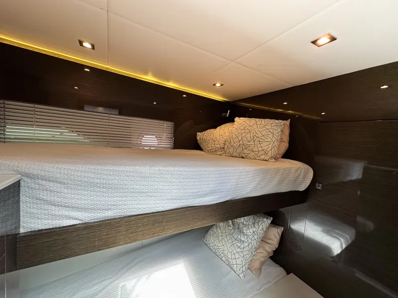 Slide: The Image of 2019 Cruisers Yachts 50 Cantius interior cabin with bunk beds and modern lighting. - 46