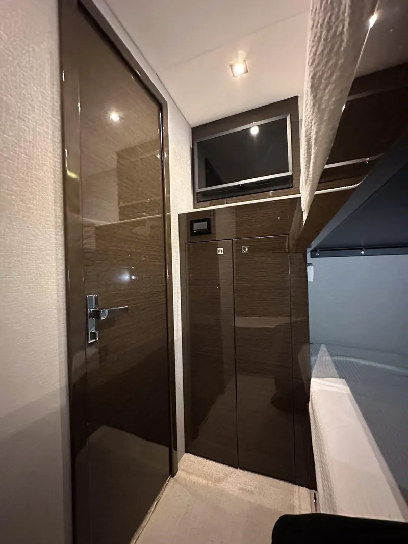 Slide: The Image of Interior cabin of 2019 Cruisers Yachts 50 Cantius with TV and storage cabinets. - 47