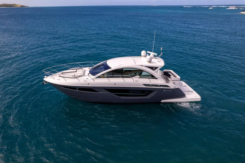 Slide: The Image of 2019 Cruisers Yachts 50 Cantius luxury yacht cruising on open water. - 5