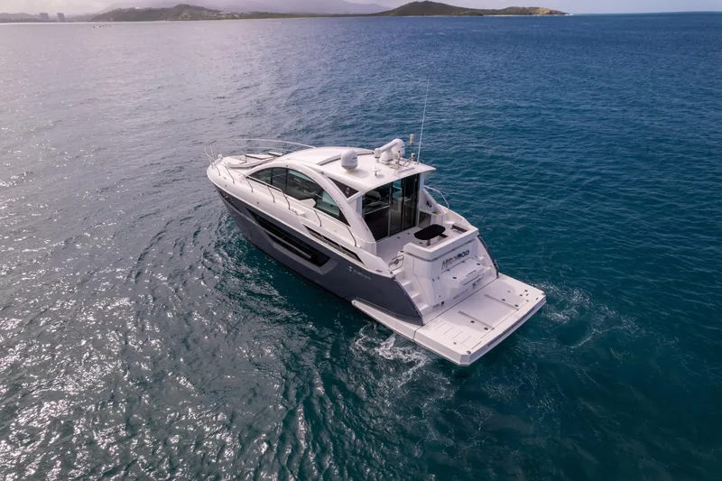 Slide: The Image of 2019 Cruisers Yachts 50 Cantius luxury yacht cruising on open water. - 6