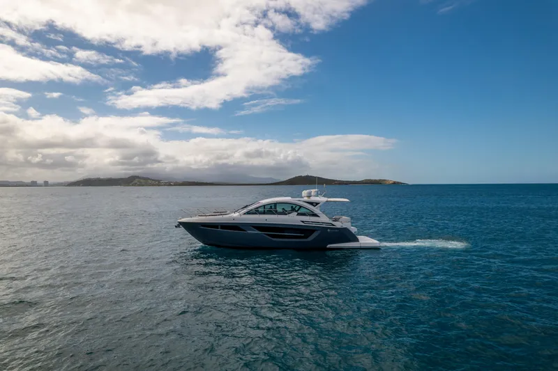 Slide: The Image of 2019 Cruisers Yachts 50 Cantius luxury yacht cruising on open water. - 8