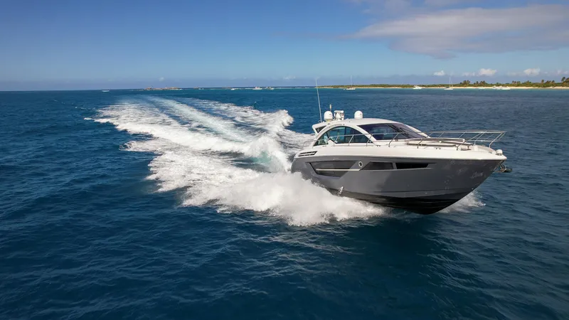 Slide: The Image of 2019 Cruisers Yachts 50 Cantius speeding on open water. - 9