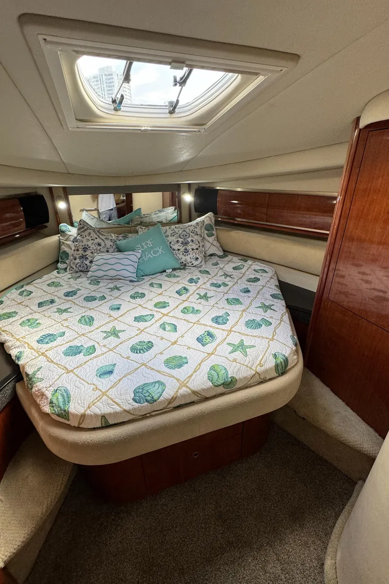 Slide: The Image of Luxurious bedroom in 2004 Sea Ray 500 Sundancer yacht with skylight. - 12