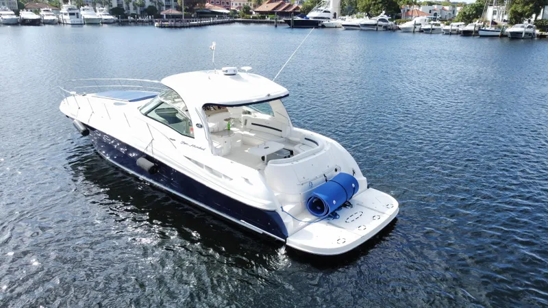 Slide: The Image of 2004 Sea Ray 500 Sundancer yacht on calm waters. - 2