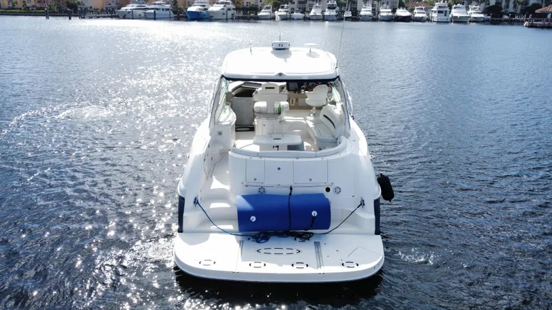 Slide: The Image of 2004 Sea Ray 500 Sundancer yacht on calm water. - 3