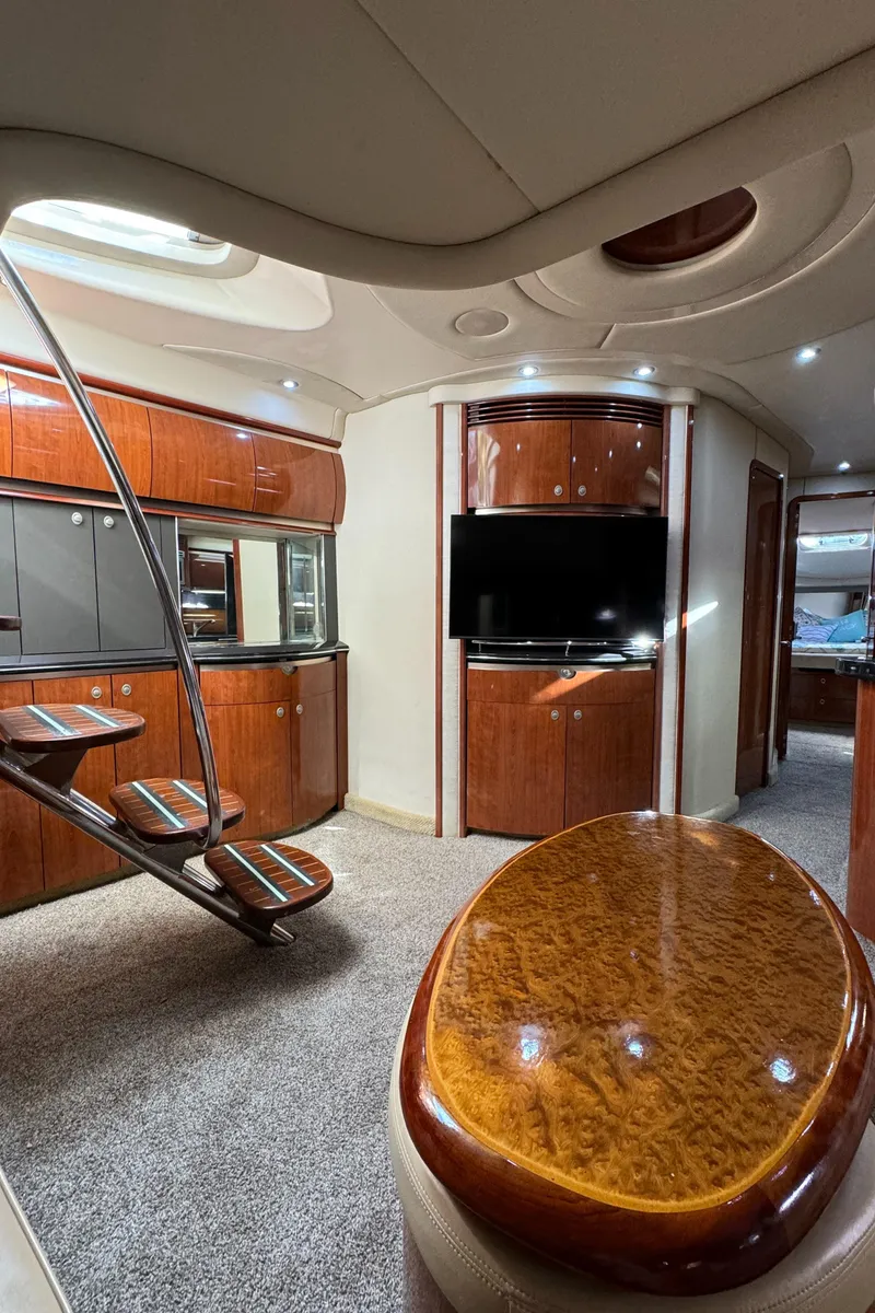 Slide: The Image of Luxurious interior of a 2004 Sea Ray 500 Sundancer yacht with wooden finishes. - 7