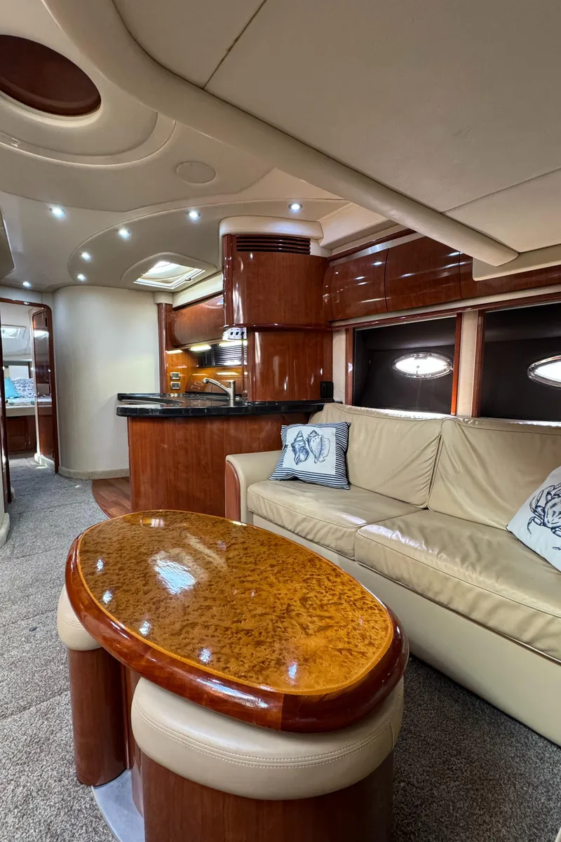 Slide: The Image of Luxurious interior of a 2004 Sea Ray 500 Sundancer yacht with elegant wood finishes. - 9