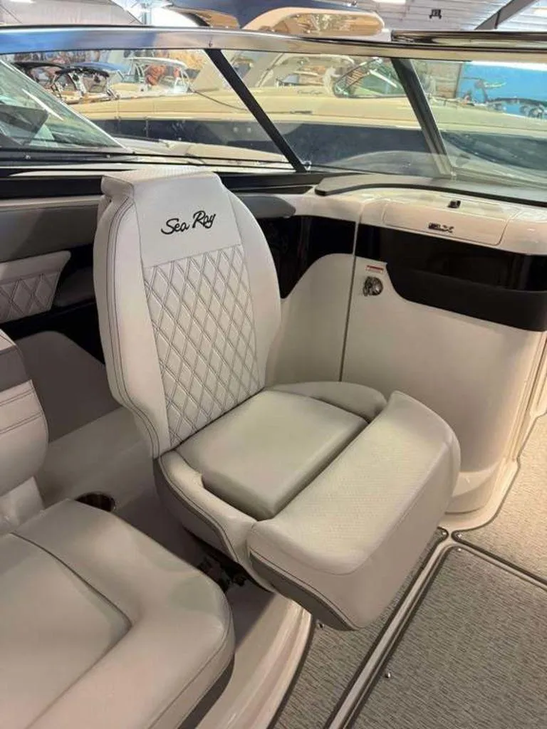 Slide: The Image of 2024 Sea Ray SLX 260 Surf boat interior with luxurious seating and elegant design. - 8