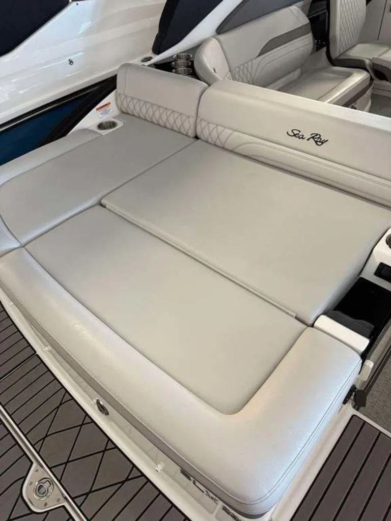Slide: The Image of 2024 Sea Ray SLX 260 Surf boat with luxurious seating and sleek design. - 9
