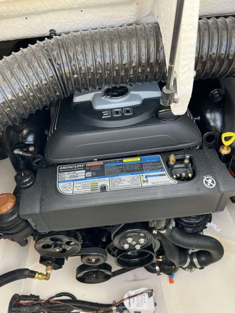 Slide: The Image of 2024 Sea Ray SDX 270 engine compartment with Mercury 300 horsepower engine. - 2