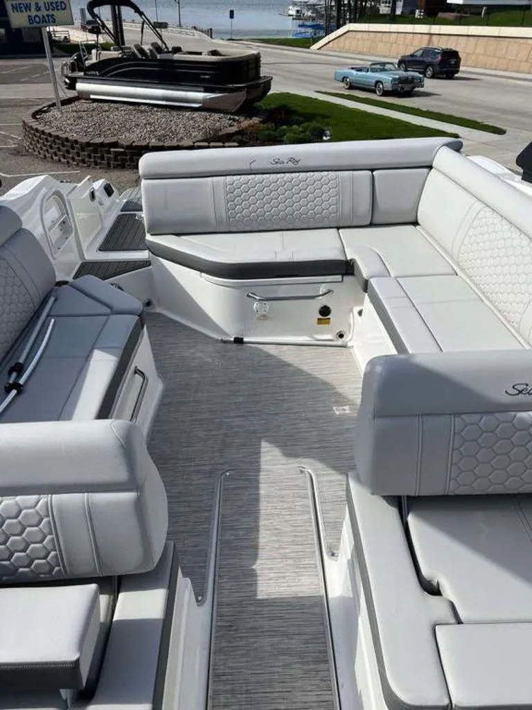 Slide: The Image of 2024 Sea Ray SDX 270 boat interior with luxurious seating and modern design. - 7