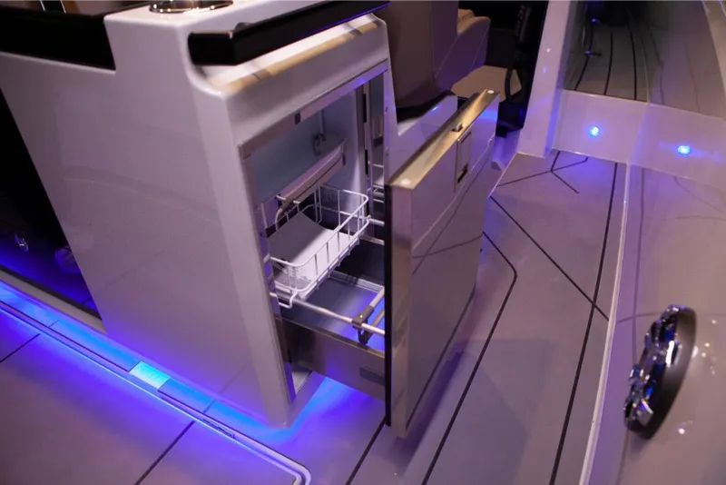 Slide: The Image of Open drawer refrigerator on the 2024 Saxdor 320 GTO boat with blue LED lighting. - 14