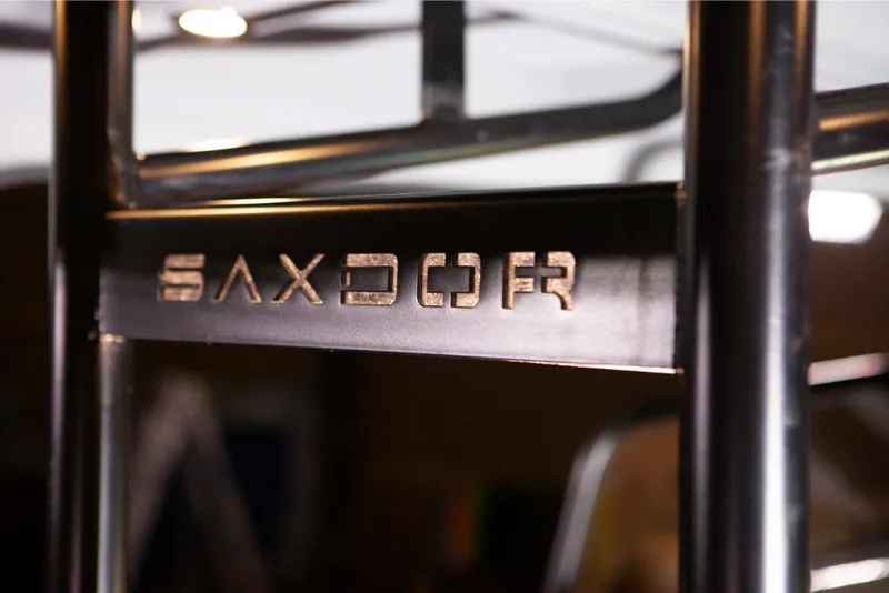 Slide: The Image of Close-up of Saxdor 320 GTO 2024 model logo on a metal frame. - 15