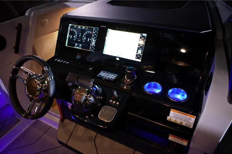 Slide: The Image of 2024 Saxdor 320 GTO dashboard with illuminated controls and modern steering wheel. - 4
