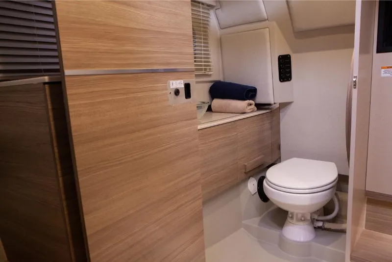 Slide: The Image of Modern bathroom interior of 2024 Saxdor 320 GTO boat with wooden cabinetry and compact toilet. - 41