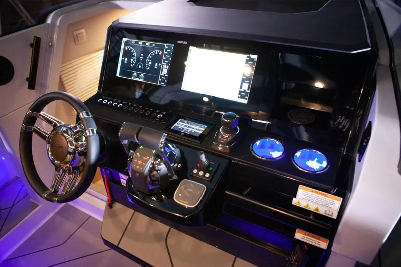 Slide: The Image of Saxdor 320 GTO 2024 dashboard with steering wheel, digital displays, and illuminated controls. - 5