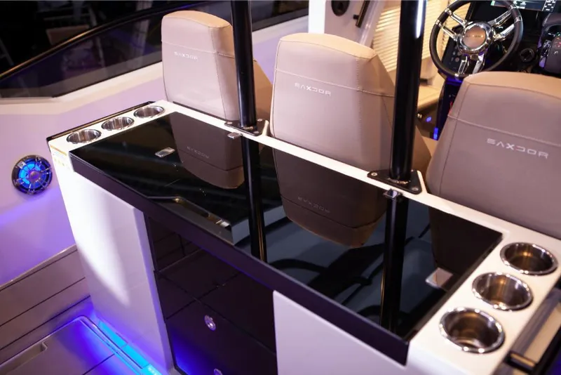 Slide: The Image of Interior of 2024 Saxdor 320 GTO boat with sleek seating and modern console. - 8
