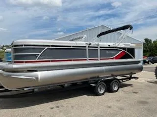 Slide: The Image of 2024 Godfrey Sweetwater 2286 pontoon boat on a trailer. - 2