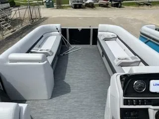 Slide: The Image of 2024 Godfrey Sweetwater 2286 pontoon boat interior with spacious seating and modern dashboard. - 3