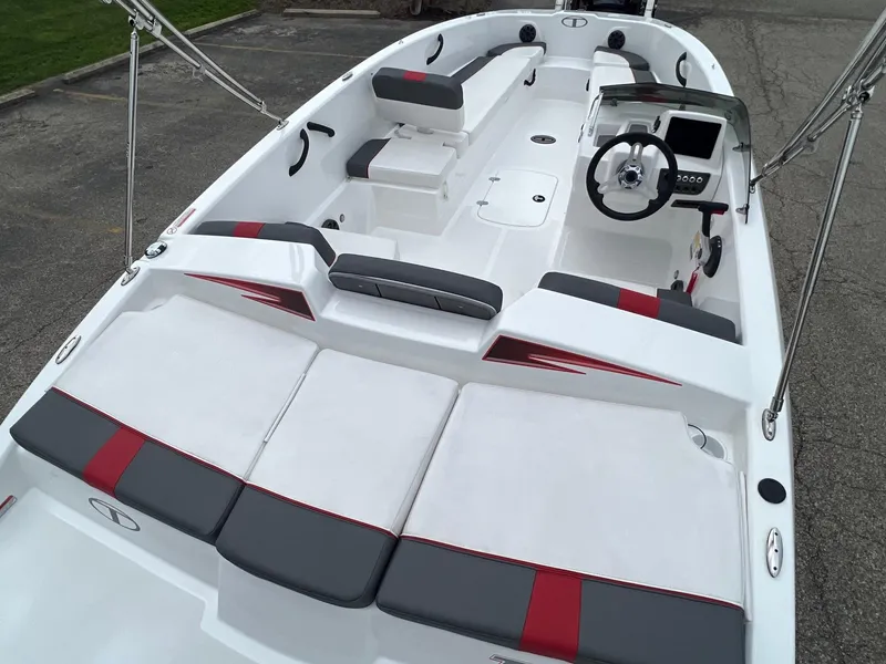 Slide: The Image of 2024 Tahoe T18 boat interior with modern seating and steering console. - 2