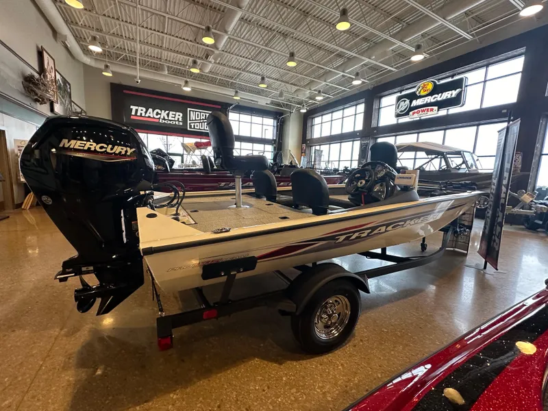 Slide: The Image of 2024 Tracker Pro Team 175 TF boat on display in showroom. - 2