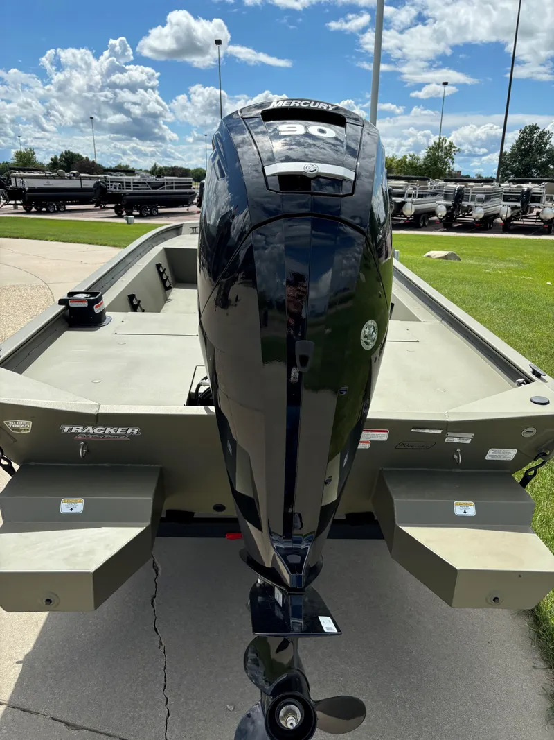 Slide: The Image of 2024 Tracker Grizzly 1860 CC boat with Mercury 90 outboard motor. - 2