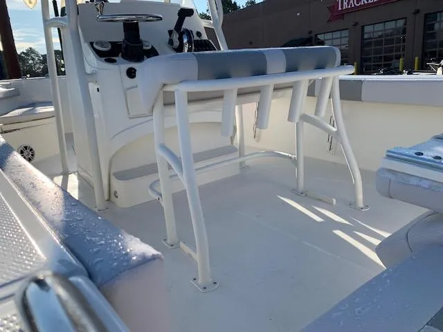 Slide: The Image of 2024 Mako 214 CC center console boat interior with seating and controls. - 2
