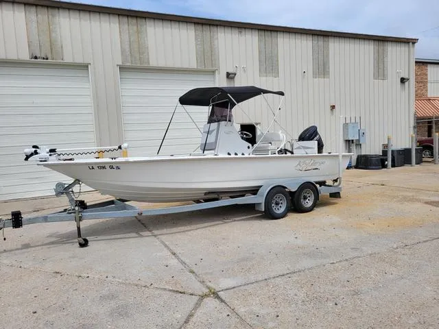 Slide: The Image of 2019 Key Largo 220 BAY boat on trailer outside a warehouse. - 4