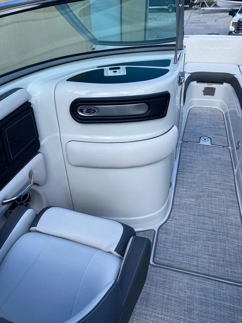 Slide: The Image of 2024 Crownline 250 XSS boat interior with seating and storage compartments. - 10