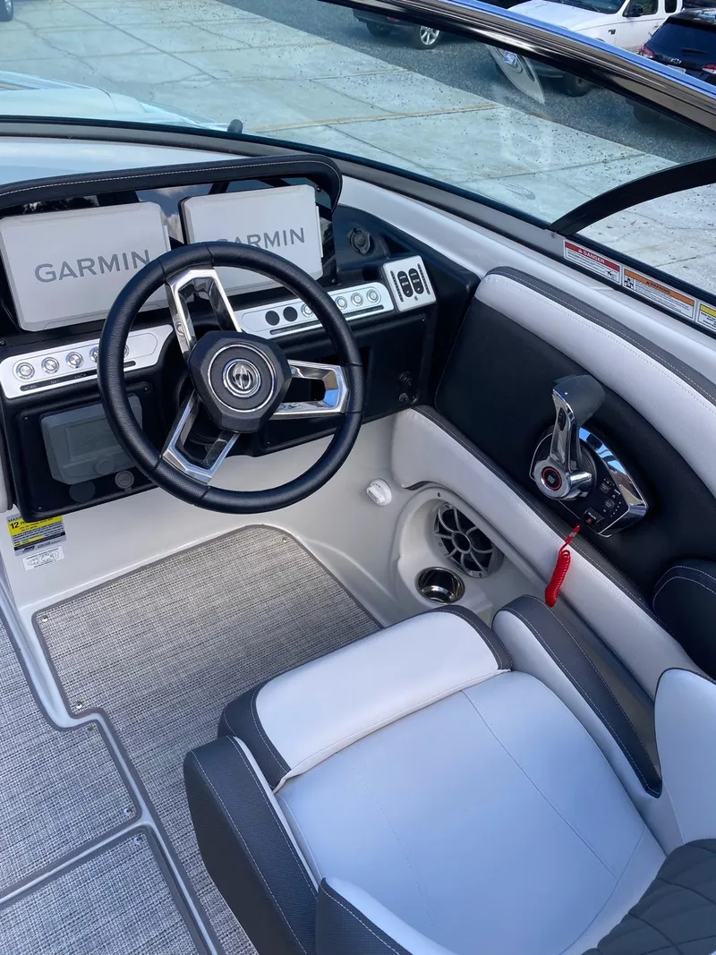 Slide: The Image of 2024 Crownline 250 XSS boat cockpit with Garmin navigation system. - 12