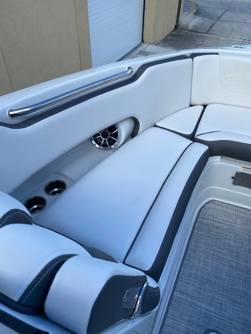 Slide: The Image of 2024 Crownline 250 XSS boat interior with white and gray seating. - 15