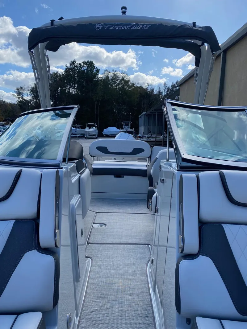 Slide: The Image of 2024 Crownline 250 XSS boat interior with open bow and seating. - 17