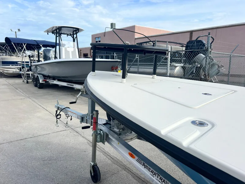 Slide: The Image of 2024 Maverick 18 HPX-V boat on trailer in a marina. - 10