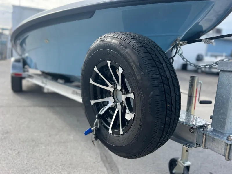 Slide: The Image of 2024 Maverick 18 HPX-V boat on trailer with spare tire. - 3