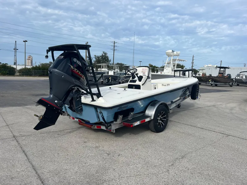 Slide: The Image of 2024 Maverick 18 HPX-V boat on trailer, rear view, parked outdoors. - 8
