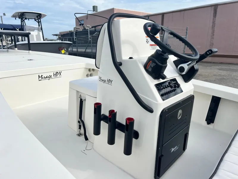 Slide: The Image of 2024 Maverick 18 HPX-V center console with steering wheel and rod holders. - 9
