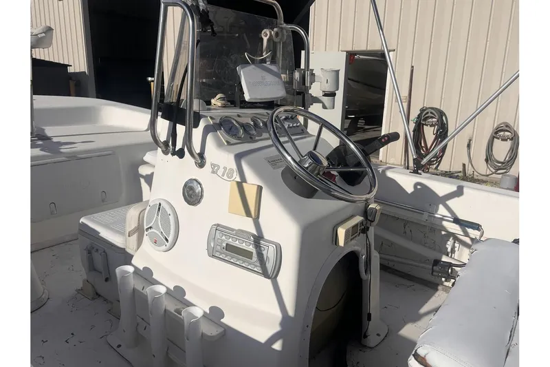 Slide: The Image of 2008 Sundance B18CC boat console with steering wheel and controls. - 11